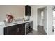 Attractive wet bar area with sleek cabinetry, countertop, and a wine refrigerator at 1049 Brandsford Nw St # 27-01, Atlanta, GA 30318