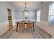 Elegant dining room with modern chandelier, neutral paint, and wainscoting at 1510 Ridgemill Ter, Dacula, GA 30019