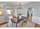 Dining room with neutral paint, wainscoting and hardwood flooring at 1510 Ridgemill Ter, Dacula, GA 30019