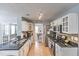 Well-equipped kitchen featuring granite countertops, stainless steel appliances, and tile backsplash at 1510 Ridgemill Ter, Dacula, GA 30019