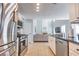 Bright kitchen with stainless steel appliances, granite countertops, and open to the living area at 1510 Ridgemill Ter, Dacula, GA 30019