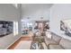 Open-concept living room with tall ceilings and view to kitchen and dining area at 1510 Ridgemill Ter, Dacula, GA 30019