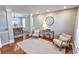 Inviting living room with hardwood floors, comfortable seating, and views into the dining area at 1510 Ridgemill Ter, Dacula, GA 30019