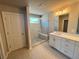 Modern bathroom featuring a glass-enclosed shower, single vanity, and stylish tile flooring at 316 Willow Cv, Canton, GA 30114