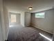 This bedroom has neutral walls, carpet, and a window letting in natural light at 316 Willow Cv, Canton, GA 30114