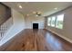 Spacious living room featuring a fireplace, hardwood floors, recessed lighting, and ample windows at 316 Willow Cv, Canton, GA 30114