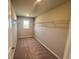 Walk-in closet with carpet, shelving, and space for storage at 316 Willow Cv, Canton, GA 30114