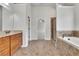 Spacious bathroom with a soaking tub, walk-in shower and double vanity at 681 Deer Springs Way, Loganville, GA 30052