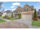 Beautiful two-story home with a two-car garage, manicured lawn and complemented by tasteful landscaping at 681 Deer Springs Way, Loganville, GA 30052