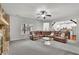 Comfortable living room featuring a stone fireplace, plush carpet, recessed lighting, and a large sectional sofa at 681 Deer Springs Way, Loganville, GA 30052