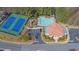 Aerial view of community amenities with tennis courts, swimming pool, playground, and clubhouse at 7467 Portbury Park Ln, Suwanee, GA 30024