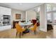 View of the light-filled breakfast nook with seating for four adjacent to kitchen at 7467 Portbury Park Ln, Suwanee, GA 30024