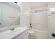 Clean bathroom featuring a single sink vanity, tile floor, and shower-tub combo at 142 Parkside Dr, Stockbridge, GA 30281