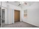 Spacious bedroom with large closet, neutral carpet and ceiling fan at 142 Parkside Dr, Stockbridge, GA 30281