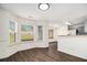 Charming breakfast nook with large windows and view into the kitchen area at 142 Parkside Dr, Stockbridge, GA 30281
