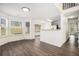 Charming breakfast nook with large windows and view into the kitchen area at 142 Parkside Dr, Stockbridge, GA 30281