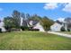 Beautiful home with lush front lawn, a cozy facade, and a convenient two-car garage in a friendly neighborhood at 142 Parkside Dr, Stockbridge, GA 30281