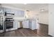 Modern kitchen featuring stainless steel appliances and grey cabinets at 142 Parkside Dr, Stockbridge, GA 30281