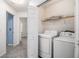 Bright laundry room with modern white washer and dryer appliances in a closet at 142 Parkside Dr, Stockbridge, GA 30281