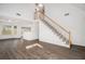 Open-concept living area with a staircase and hardwood floors at 142 Parkside Dr, Stockbridge, GA 30281