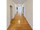 Hallway with hardwood floors and multiple doors at 1890 Glenhurst Dr, Snellville, GA 30078