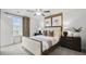 Bright bedroom features neutral tones, ceiling fan, ensuite bathroom, and great natural light at 221 Kindness Cir, Mcdonough, GA 30252