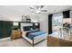 Stylish bedroom with a dark accent wall, modern furnishings, and ample natural light for a cozy space at 221 Kindness Cir, Mcdonough, GA 30252