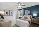 Cheerful bedroom with a comfortable bed, stylish artwork, and bright colors creating a welcoming space at 221 Kindness Cir, Mcdonough, GA 30252