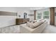 Comfortable second living room with a cozy sofa, modern decor, and bright windows for a relaxing space at 221 Kindness Cir, Mcdonough, GA 30252