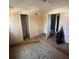 Bedroom with unfinished hardwood floors and two doorways in need of renovation at 2836 Oldknow Dr, Atlanta, GA 30318