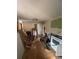 Living room with hardwood floors, a ceiling light, and renovation debris, including a ladder at 2836 Oldknow Dr, Atlanta, GA 30318