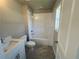 Bathroom featuring a tub, white vanity with modern fixtures, and tiled floor at 320 Willow Cv, Canton, GA 30114