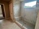 Modern bathroom featuring a glass-enclosed shower with marble-style tiling and built-in bench at 320 Willow Cv, Canton, GA 30114
