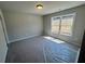 Bright bedroom with large window and neutral walls at 320 Willow Cv, Canton, GA 30114
