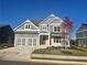 Stunning two-story home featuring a two-car garage and a beautifully landscaped front yard at 320 Willow Cv, Canton, GA 30114