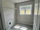 Laundry room with tile floor, wire shelving and natural light at 320 Willow Cv, Canton, GA 30114