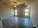 Large main bedroom with tray ceiling, ceiling fan, and two windows offering plenty of natural light at 320 Willow Cv, Canton, GA 30114