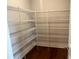 Walk-in pantry featuring sturdy wire shelving for efficient storage of groceries and kitchen essentials at 320 Willow Cv, Canton, GA 30114