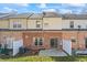Exterior townhouse view with brick, two AC units, small patio and partial privacy fences at 3815 Pleasant Oaks Dr, Lawrenceville, GA 30044