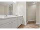 Bathroom with dual sinks, white cabinetry, and shower at 3815 Pleasant Oaks Dr, Lawrenceville, GA 30044