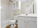 Bright bathroom with white cabinets, tub, and shower combination at 3815 Pleasant Oaks Dr, Lawrenceville, GA 30044
