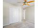 Cozy bedroom with ceiling fan and large closet doors at 3815 Pleasant Oaks Dr, Lawrenceville, GA 30044