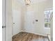 Entryway featuring stylish wood-look floors, neutral walls, and a convenient coat closet for storage at 3815 Pleasant Oaks Dr, Lawrenceville, GA 30044