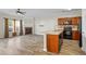 Open concept kitchen and living room with an island, a fireplace, and lots of natural light at 3815 Pleasant Oaks Dr, Lawrenceville, GA 30044