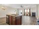 Modern kitchen island with a breakfast bar overlooking the living area and a cozy fireplace, perfect for entertaining at 3815 Pleasant Oaks Dr, Lawrenceville, GA 30044
