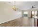 Open living and dining space featuring sleek floors, modern lighting, and a sliding glass door to the outdoor area at 3815 Pleasant Oaks Dr, Lawrenceville, GA 30044