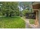 Expansive backyard offers a great space to enjoy nature near the screened in porch at 422 Derbyshire Dr, Stone Mountain, GA 30088