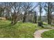 Large backyard showcasing mature trees and lush greenery at 422 Derbyshire Dr, Stone Mountain, GA 30088