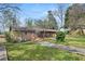 Brick home with a spacious yard and screened-in porch, perfect for outdoor living at 422 Derbyshire Dr, Stone Mountain, GA 30088