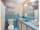 Full bathroom with a bathtub and classic blue tiling at 422 Derbyshire Dr, Stone Mountain, GA 30088
